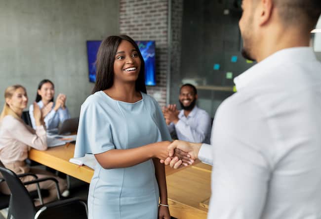 male-boss-handshaking-and-greeting-african-america-2021-10-20-00-22-51-utc (1)